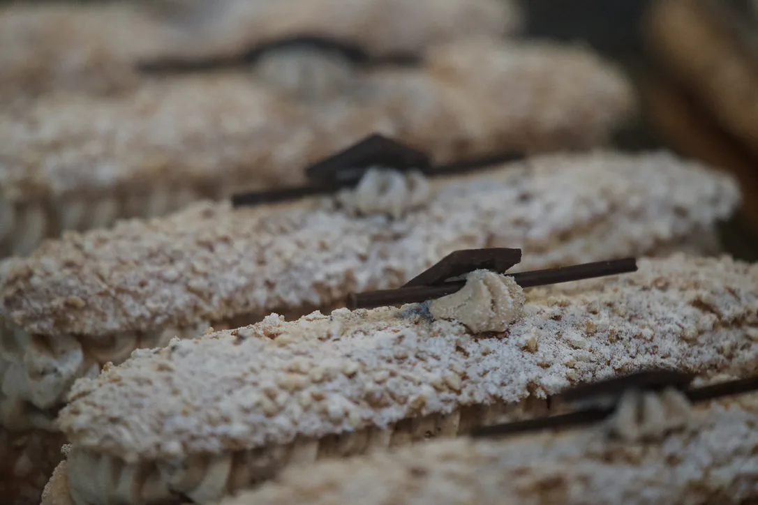Macro study of sugared almond pastry slices with small forks